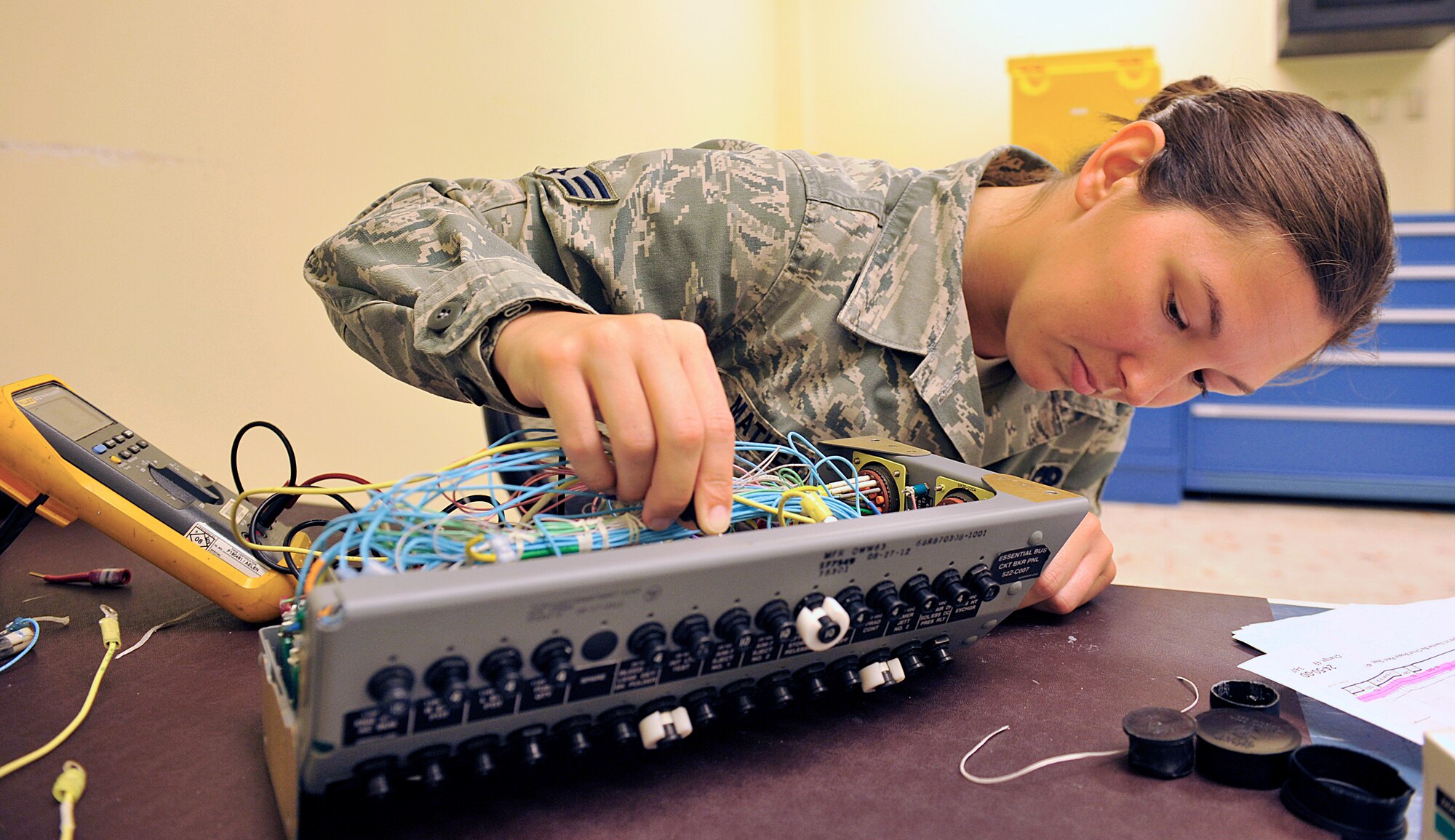 U.S. Air Force Senior Airman Erin Matheny, 18th Component Maintenance Squadron electrical and environmental journeyman, checks for applying power of an F-15C Eagle essential bus circuit breaker panel on Kadena Air Base, Japan, June 29, 2015. Airmen from 18th CMS have been working around-the-clock to rewire F-15C Eagle essential bus circuit breaker panels to help increase mission capabilities and to ensure unmatched combat power of Kadena's aircraft. (U.S. Air Force photo by Naoto Anazawa)


