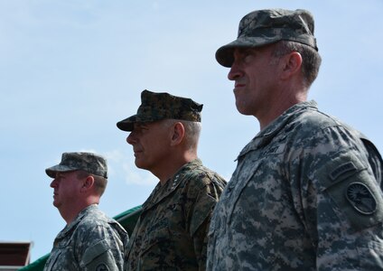 From left to right, Col. Kirk Dorr, JTF-Bravo outgoing commander, Gen. John Kelly, U.S. Southern Command commander, and Col. Robert Harman, Joint Task Force – Bravo incoming commander, inspect the formation during a change of command ceremony June 30, 2015, at Soto Cano Air Base, Honduras. Kelly presided over the ceremony, during which Dorr relinquished command to Harman, an Army Ranger with 24 years of service. (U.S. Air Force photo by Martin Chahin)