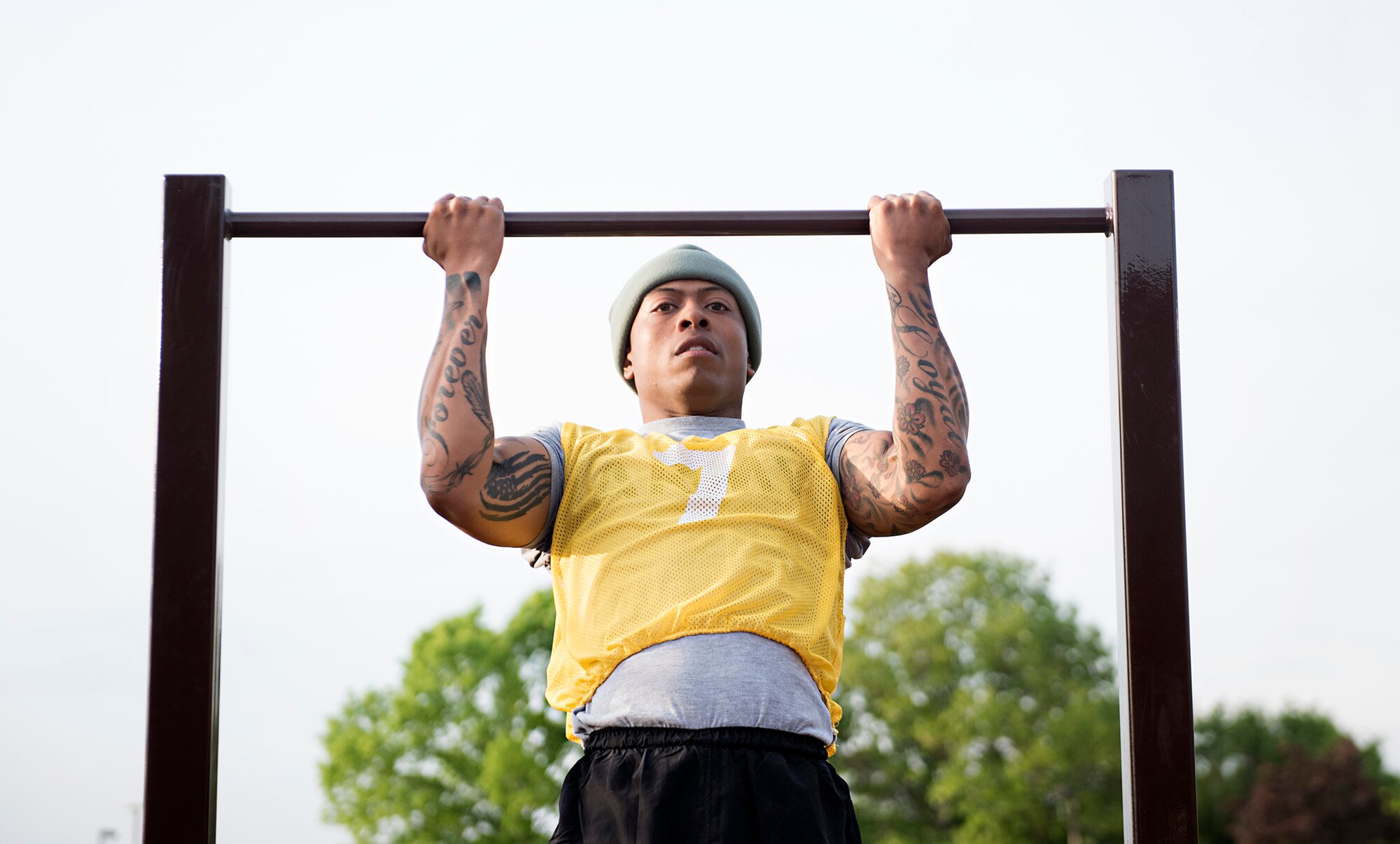Army Sgt. Darius Foster, 78th Training Division, performs pull ups during the multi-service physical fitness test portion of the Joint Base Service Member of the Year Competition May 14, 2015 at Joint Base McGuire-Dix-Lakehurst N.J. This was the first annual competition and featured seven events including a marksmanship qualification, first aid, a 100-point written examination, board appearance, urban orienteering, multi-service physical fitness test and an obstacle course. Foster won in the NCO category. (U.S. Air Force photo by Staff Sgt. Katherine Tereyama)