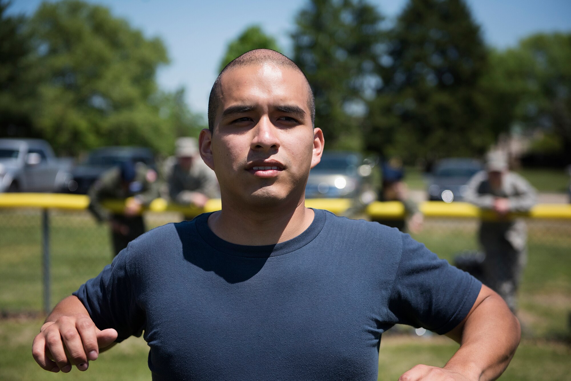 U.S. Navy Seaman Andrew Reyes, Naval Support Activity – Lakehurst, stretches before the obstacle course portion of the Joint Base Service Member of the Year Competition May 14, 2015 at Joint Base McGuire-Dix-Lakehurst N.J. This was the first annual competition and featured seven events including a marksmanship qualification, first aid, a 100-point written examination, board appearance, urban orienteering, multi-service physical fitness test and an obstacle course. (U.S. Air Force photo by Staff Sgt. Katherine Tereyama)