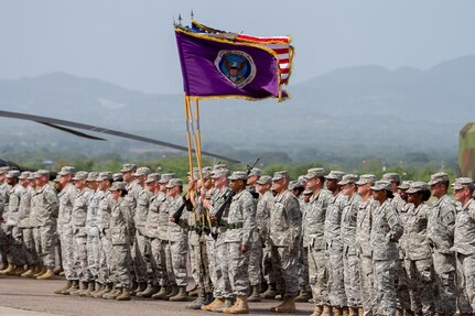 The Joint Task Force – Bravo change of command formation stands at “Parade Rest” prior to the start of the Task Force’s change of command ceremony June 30, 2015, at Soto Cano Air Base, Honduras. Hundreds of service members participated in the change of command ceremony, in which Col. Kirk Dorr relinquished command to Col. Robert Harman, JTF – Bravo’s newest commander. (U.S. Air Force photo by Martin Chahin)