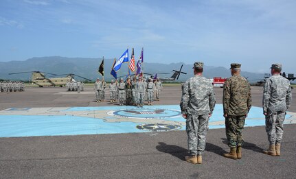 From left to right, Col. Robert Harman, Joint Task Force – Bravo incoming commander, Gen. John Kelly, U.S. Southern Command commander, and Col. Kirk Dorr, JTF-Bravo outgoing commander, salute the color guard during the change of command ceremony between Dorr and Harman June 30, 2015, at Soto Cano Air Base, Honduras. The change of command ceremony is a time-honored tradition which transfers responsibility to a new commander. (U.S. Air Force photo by Martin Chahin)
