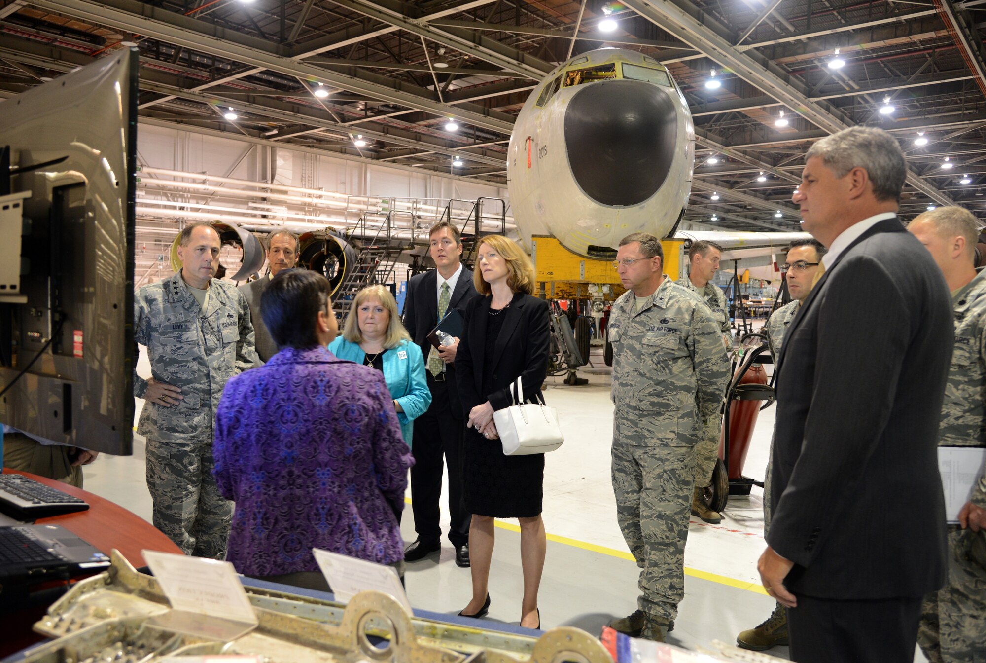 Theresa Farris, director of the 564th Aircraft Maintenance Squadron, briefs The Honorable Lisa Disbrow, the Acting Under Secretary of the Air Force and the Assistant Secretary of the Air Force for Financial Management and Comptroller, (center), and The Honorable William LaPlante, the assistant secretary of the Air Force (Acquisition) (far right), about Tinker's KC-135 programmed depot maintenance program and how utilizing the AFSC Way enables the squadron to deliver combat power to warfighter faster, with higher quality and at less cost than ever before.   Pictured, from left are, Air Force Sustainment Center Commander, Lt. Gen. Lee Levy II; Jerold Smith, Legacy Tanker Chief Engineer; Janis Wood, 76th Aircraft Maintenance Group deputy director; Kevin O'Connor, Oklahoma City Air Logistics Complex vice director; Oklahoma City Air Logistics Complex Commander, Brig. Gen. Mark Johnson; Col. William Liquori, Senior Military Assistant to the Under Secretary of the Air Force; and Lt. Col. Aaron Weiner, Military assistant to the Assistant Secretary of the Air Force (Acquisition). U.S. Air Force photo by Kelly White