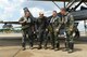 U.S. Air Force Maj. Gen. H. D. Polumbo Jr., Ninth Air Force commander, jokes with the pilots who accompanied him on his final flight at Shaw Air Force Base, S.C., June 26, 2015. The final flight, also known as the fini-flight, is a ceremonial flight for pilots to bid the departing Airman farewell. (U.S. Air Force photo by Senior Airman Diana M. Cossaboom/Released)