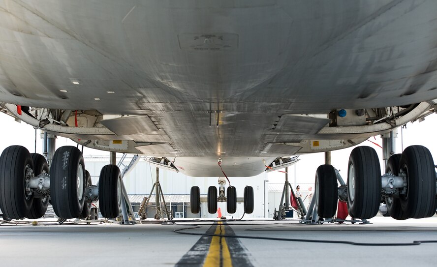 All the nose and main landing gear tires of a C-5M Super Galaxy hang over a parking spot June 25, 2015, on Dover Air Force Base, Del. Personnel from the 436th Maintenance Squadron Aero Repair shop jacked the aircraft off the flight line parking spot and performed troubleshooting procedures on the right aft main landing gear that was slow to extend in flight. (U.S. Air Force photo/Roland Balik)