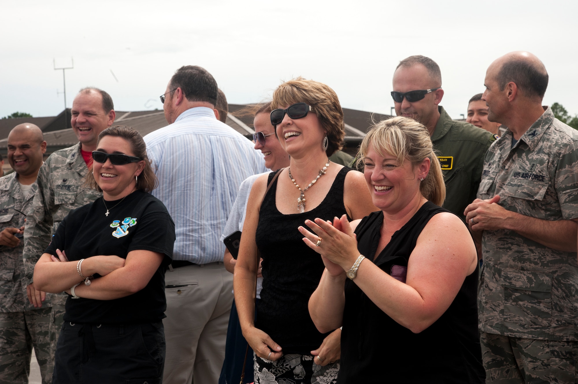 Family and friends celebrate with U.S Air Force Col. Chad Franks, 23d Wing commander, after his fini-flight June 26, 2015, at Moody Air Force Base, Ga. The "fini-flight" is a time-honored military aviation tradition marking the last flight of a pilot's or commander's time with a unit. (U.S. Air Force photo by Andrea Jenkins/Released)

