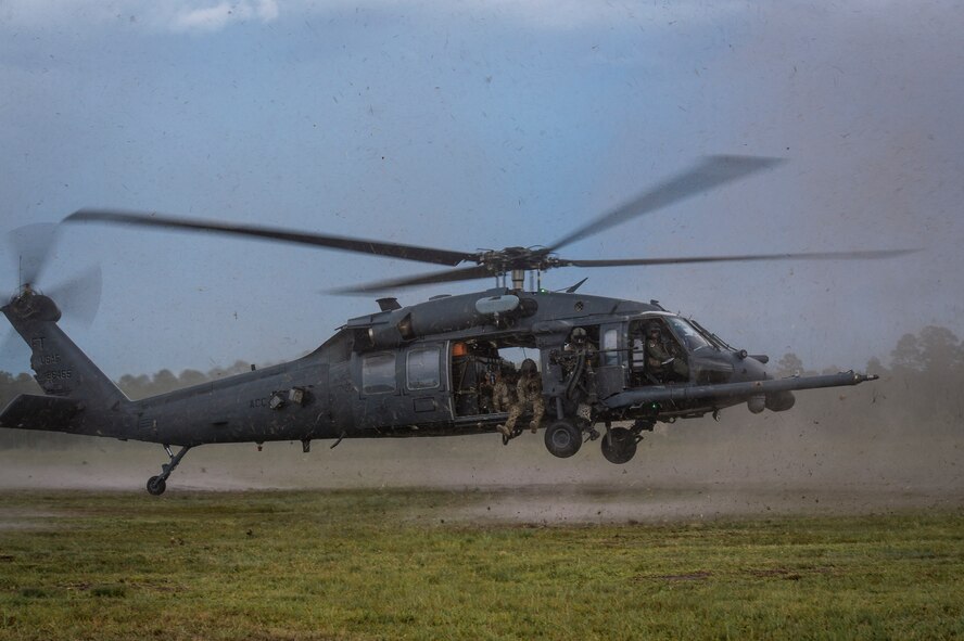 An HH-60G Pave Hawk flown by U.S. Air Force Col. Chad Franks, 23d Wing commander, lands on Grand Bay Bombing and Gunnery Range June 26, 2015, at Moody Air Force Base, Ga. Franks final flight included rescue tactics, flight maneuvers and aerial gunnery. (U.S. Air Force photo by Senior Airman Ryan Callaghan/Released)

