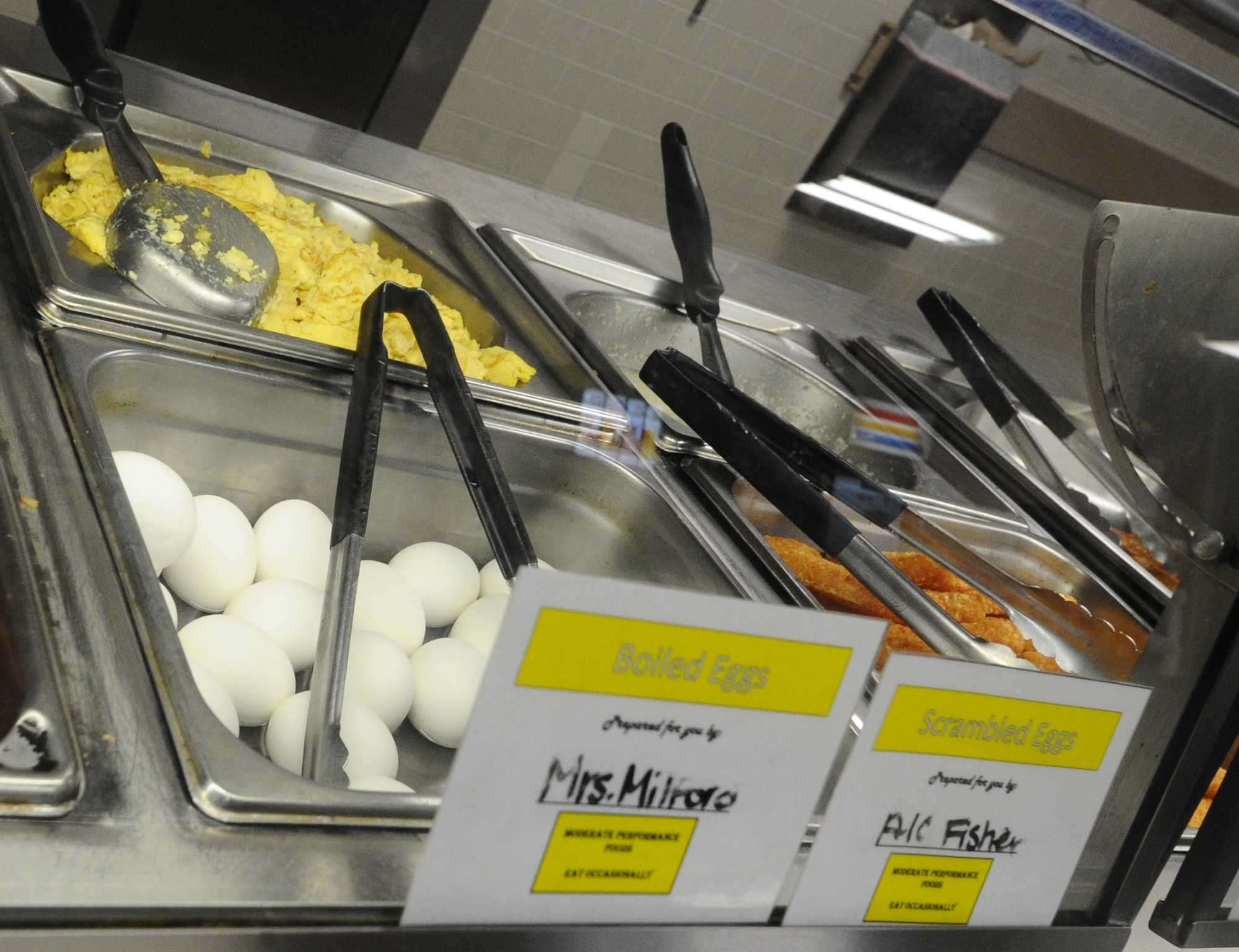 Hard-boiled and scrambled eggs sit under heating lamps June 25 at the Berg-Liles dining facility. The Air Force Services Agency has made changes to its military food operations to weigh the current case of chickens being diagnosed for the avian flu. New standards for egg related meals began July 1. (U.S. Air Force photo by Senior Airman Ty-Rico Lea/Released)
