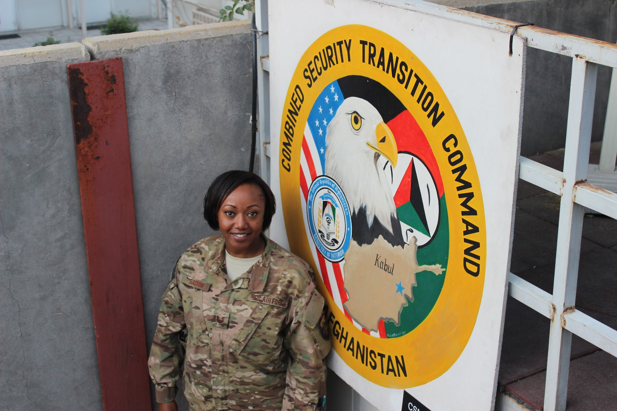 Air Force Tech. Sgt. Latoya Saxton heads into work at the Combined Security Transition Command – Afghanistan. Saxton is mobilized to Resolute Support Headquarters, where she serves as the admin support noncommissioned officer in the Administrative and Logistics Operations Cell. (U.S. military photo by Lt. j.g. Charity Edgar/Released)