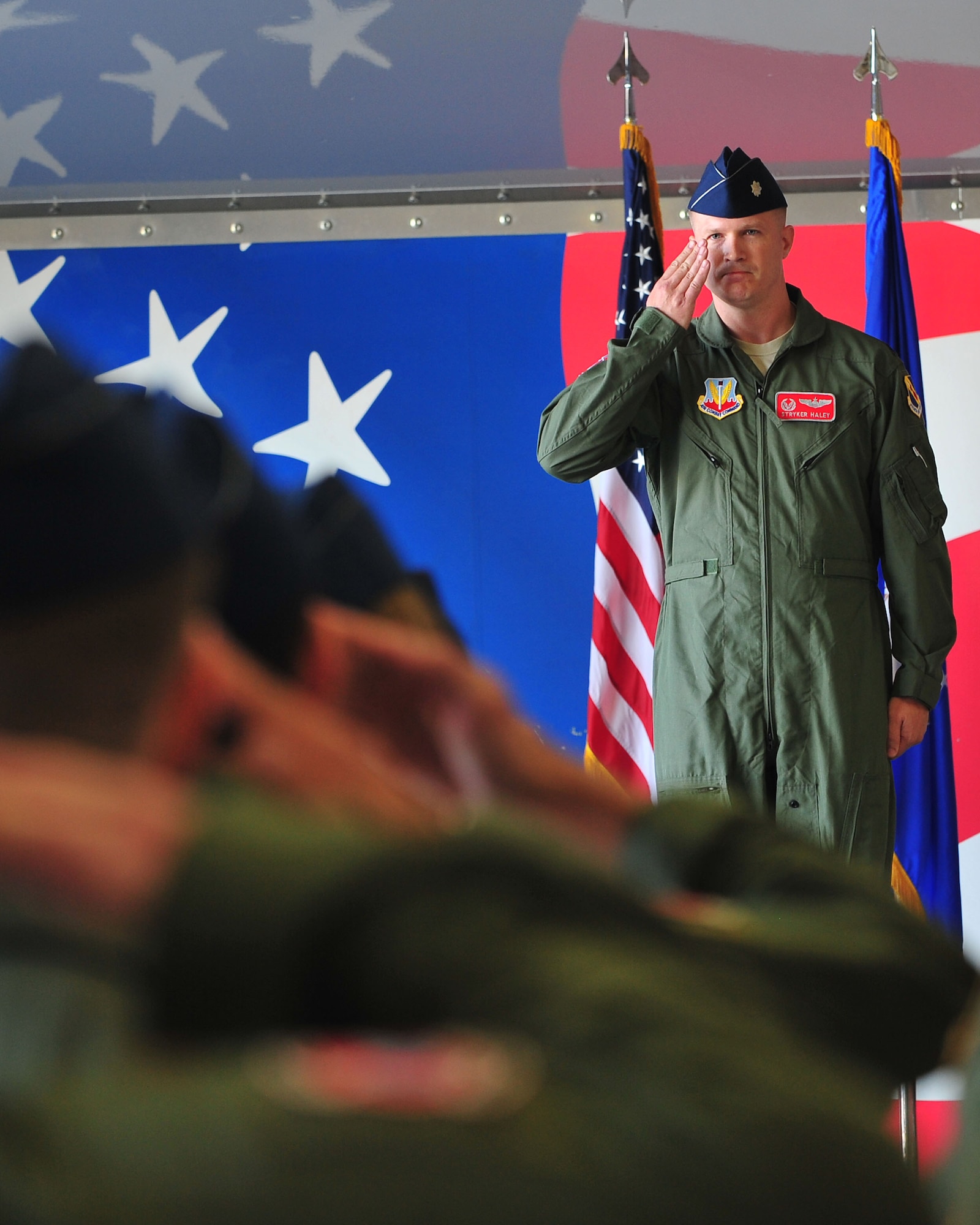 Lt. Col. Don Haley, incoming 333rd Fighter Squadron commander, renders his first salute to fellow Airmen after assuming command during the 333rd FS change of command ceremony, June 30, 2015, at Seymour Johnson Air Force Base, North Carolina. The 333rd FS is one of two squadrons here which conduct formal training for all F-15E aircrew members. (U.S. Air Force photo/Senior Airman John Nieves Camacho)