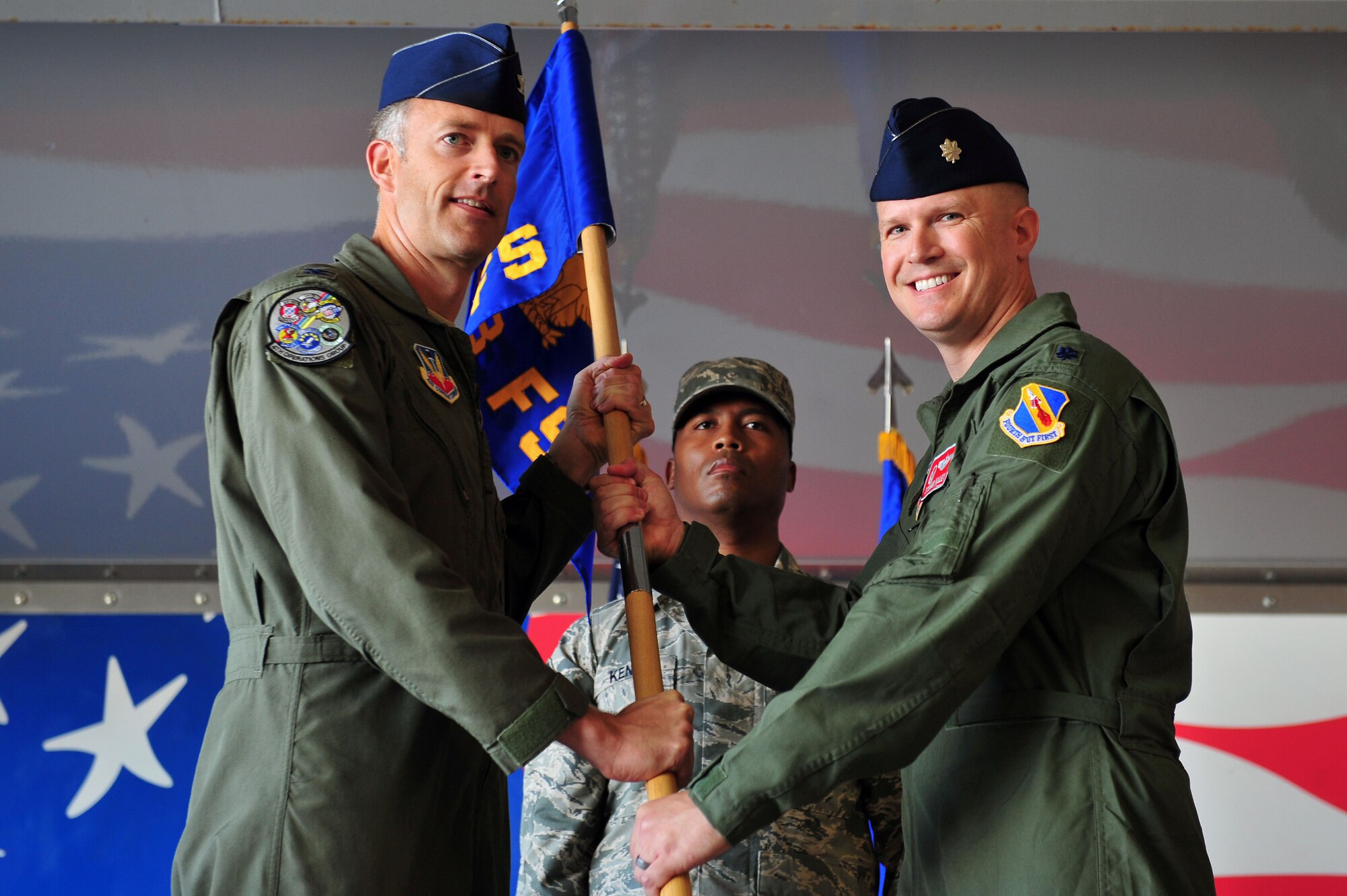Col. Brian Afflerbaugh, left, 4th Operations Group commander, passes the guidon to Lt. Col. Don Haley, incoming 333rd Fighter Squadron commander, during the 333rd FS change of command ceremony, June 30, 2015, at Seymour Johnson Air Force Base, North Carolina. Haley is a senior pilot with more than 2,800 flight hours and 699 combat hours. (U.S. Air Force photo/Senior Airman John Nieves Camacho)