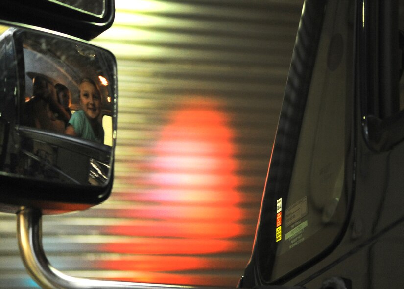 A Science and Technology Academies Reinforcing Basic Aviation and Space Exploration student makes herself comfortable in the driver’s seat of a 4th Civil Engineer Squadron explosive ordnance disposal vehicle, June 25, 2015, at Seymour Johnson Air Force Base, North Carolina. Students also watched a demonstration from an EOD robot and learned about different types of ordnance during their tour of the EOD shop. (U.S. Air Force photo/Senior Airman Ashley J. Thum)