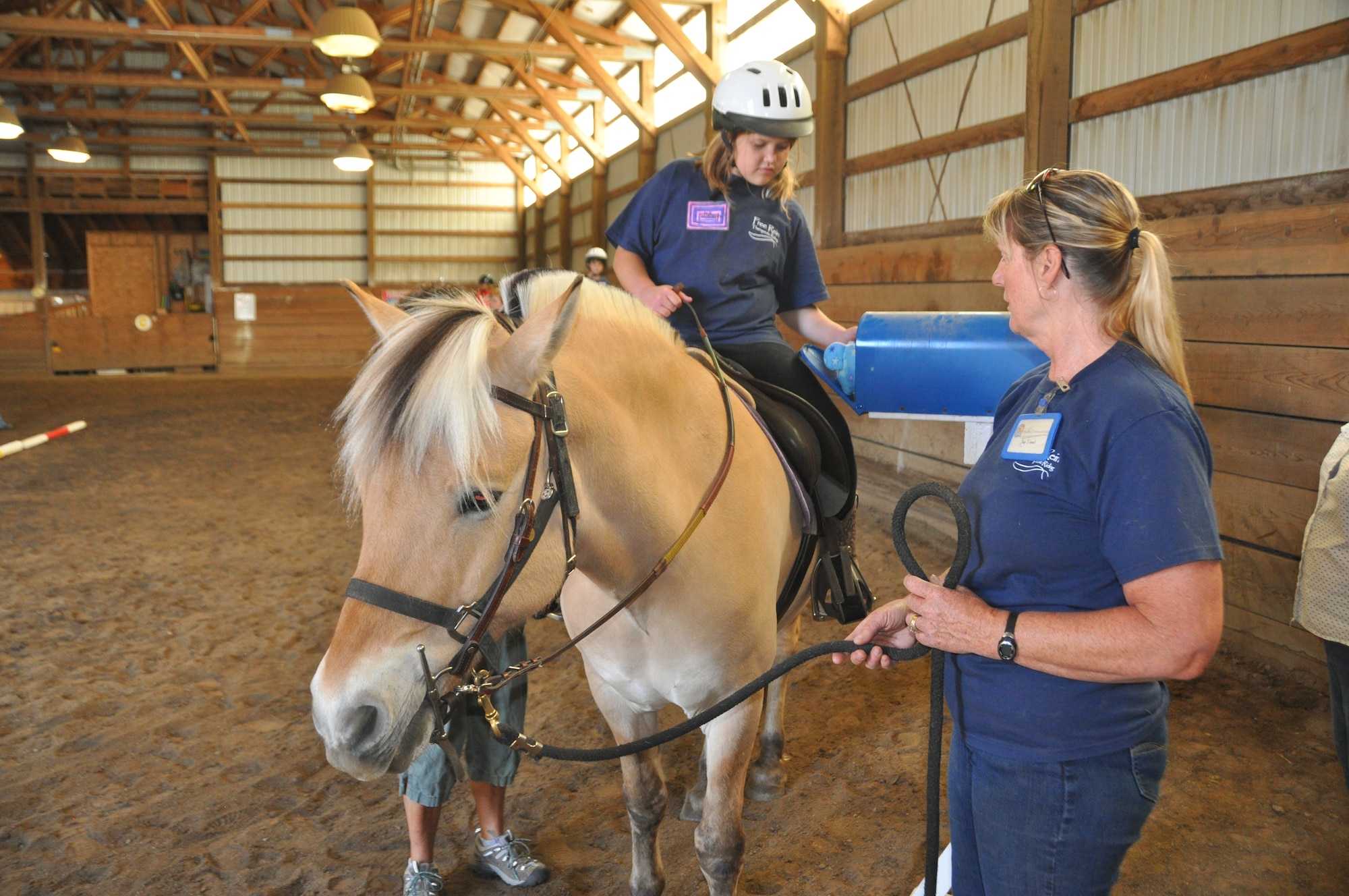 Kathryn Steege, daughter of Chief Master Sgt. Jason Steege of the 92nd Medical Group, rides her horse up to a mailbox to retrieve a plush toy during a day camp at a Hippotherapy facility June 22, 2015, in Spokane, Wash. Several Team Fairchild children participated in the five-day camp where they learned how to interact with horses and did activities on horseback that translate to everyday life. (U.S. Air Force photo/2nd Lt. Shelley Gregory)