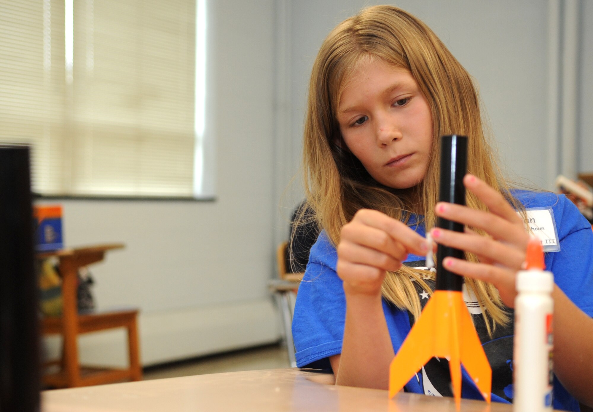 A Science and Technology Academies Reinforcing Basic Aviation and Space Exploration student assembles a miniature rocket during her flight’s time in the program’s rocketry class at Greenwood Middle School, June 25, 2015, in Goldsboro, North Carolina. STARBASE students were divided into four flights and spent their mornings learning about rocketry, oceans of air, compass reading and the laws of motion. (U.S. Air Force photo/Senior Airman Ashley J. Thum)