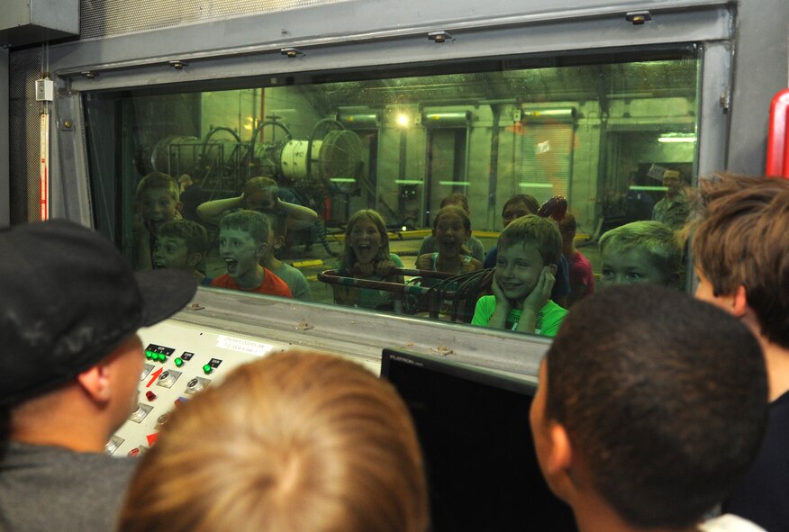 Science and Technology Academies Reinforcing Basic Aviation and Space Exploration students test the soundproofing of the 4th Component Maintenance Squadron’s “Hush House” control room, June 23, 2015, at Seymour Johnson Air Force Base, North Carolina. F-15E Strike Eagle engines are activated in the main room of the “Hush House” allowing Airmen to assess problems or discrepancies in their operation.  (U.S. Air Force photo/Senior Airman Ashley J. Thum)