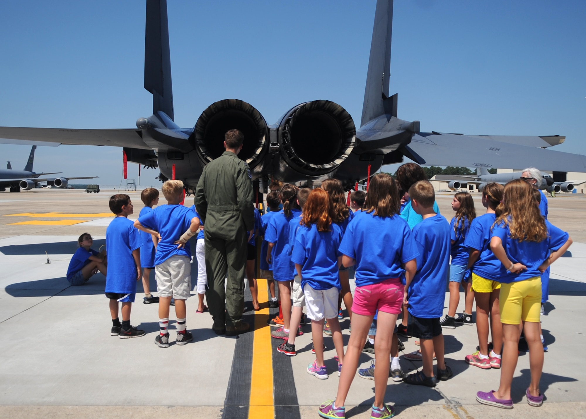 Capt. Tom Morrill, Science and Technology Academies Reinforcing Basic Aviation and Space Exploration commander, explains features of the F-15E Strike Eagle to STARBASE students, June 22, 2015, at Seymour Johnson Air Force Base, North Carolina. STARBASE is an annual, week-long program for children entering the fifth grade to enhance their knowledge of aviation science and other related subjects. (U.S. Air Force photo/Senior Airman Ashley J. Thum)
