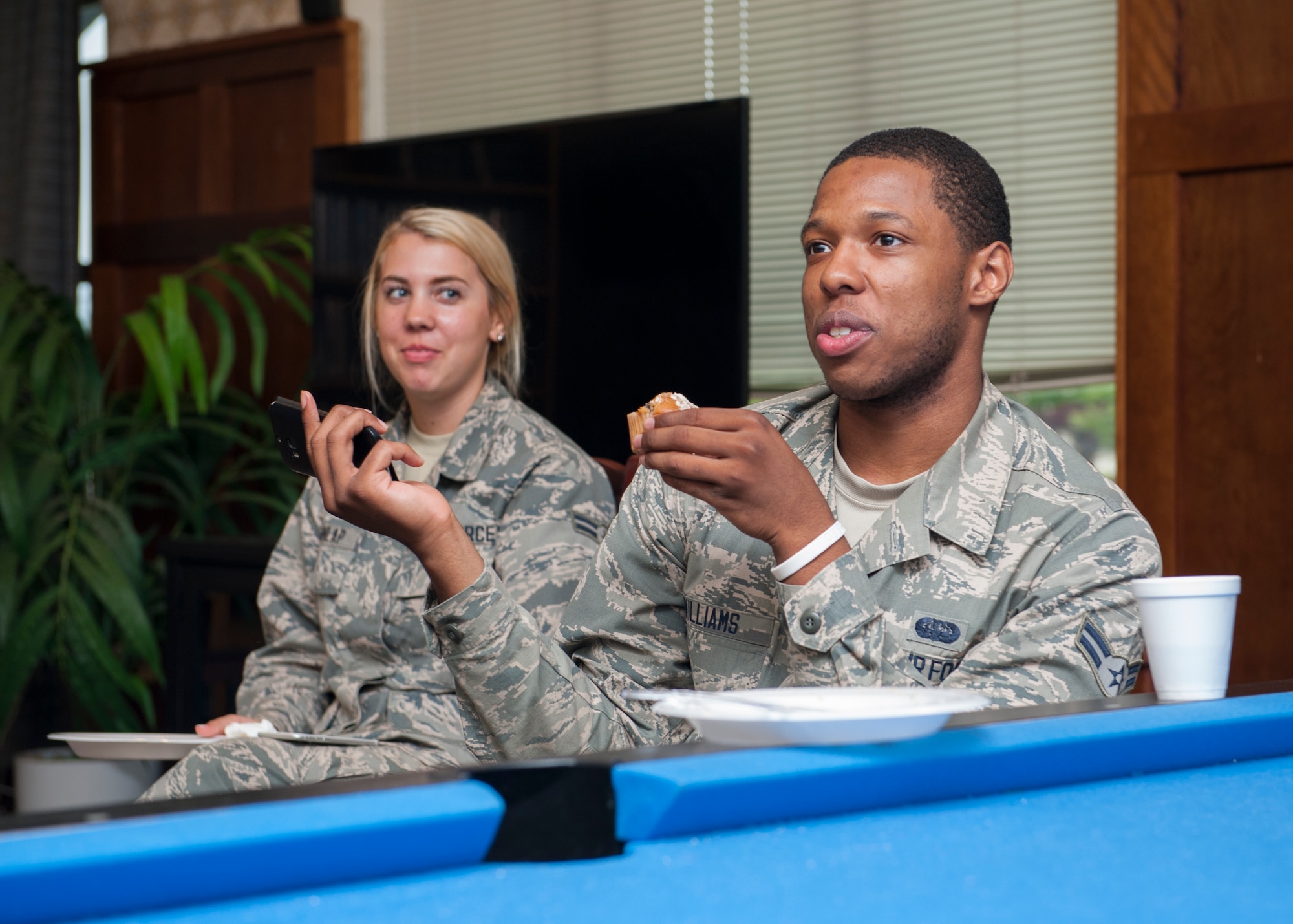 Airman 1st Class Lauren Dunlap, 436th Communications Squadron client systems technician, and Airman 1st Class Julian Williams, 436th CS knowledge manager, attended a dorm dinner June 25, 2015, at Dover Air Force Base, Del. Approximately 50 dorm resident Airmen attended the dinner. (U.S. Air Force photo/Airman 1st Class Zachary Cacicia)