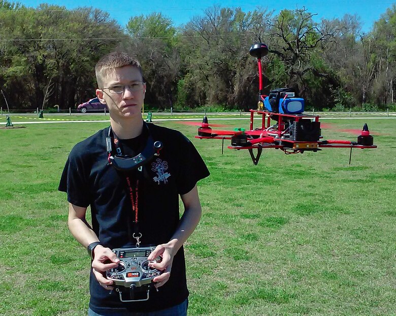 Senior Airman James Barrigar, 543rd Support Squadron, hovers his quad copter racer, checking for any abnormalities prior to a drone race March 14 in Olmos Park, San Antonio. (U. S. Air Force photo by William Belcher) 