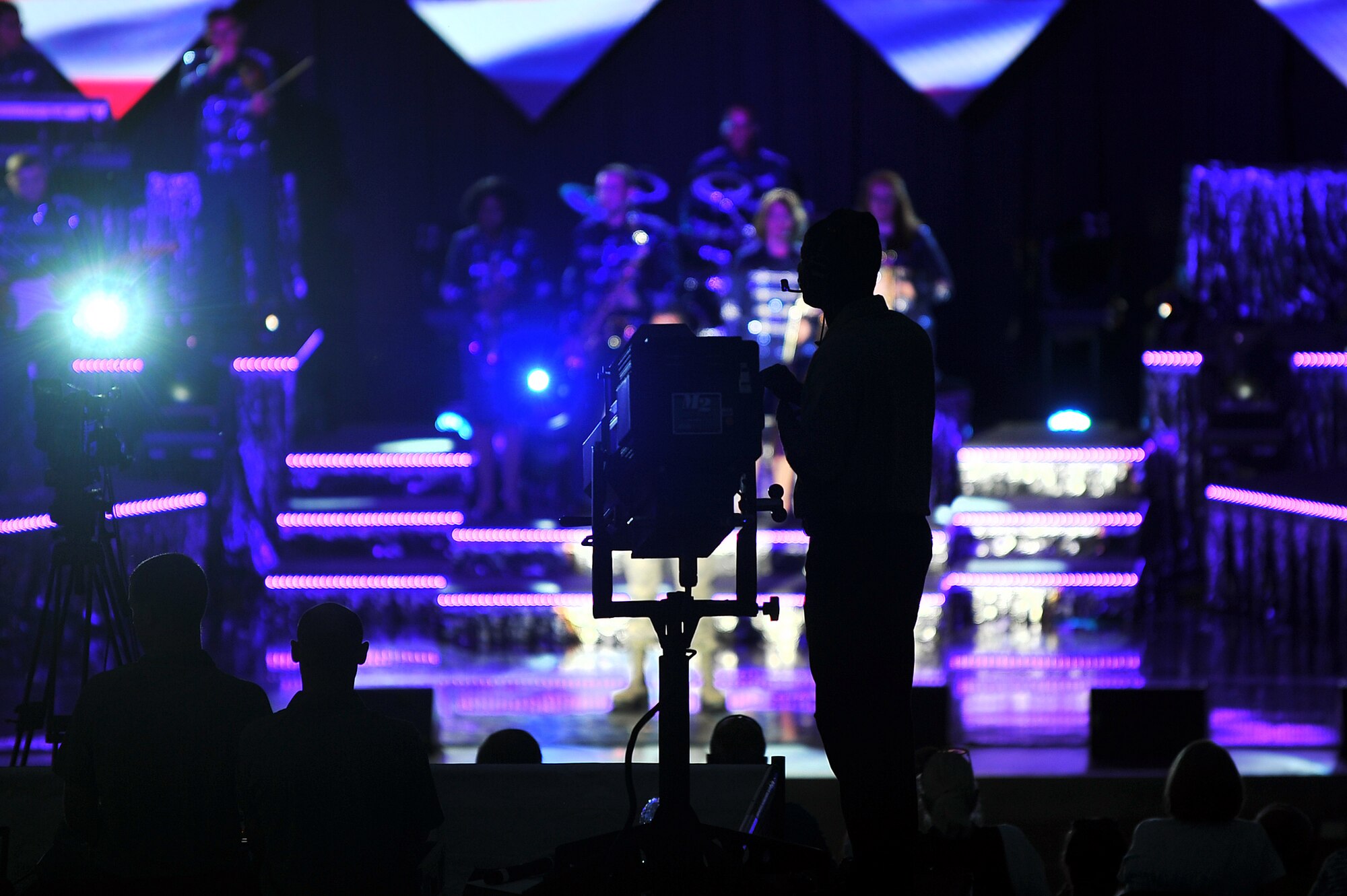 The Tops in Blue Technical Staff illuminate the performers June 27 at the Sumtur Amphitheater, Papillion, Neb.  Tops in Blue hires top talent from around the Air Force to assemble a team of both technically and musically gifted people. (U.S. Air Force photo by/Josh Plueger Released)   