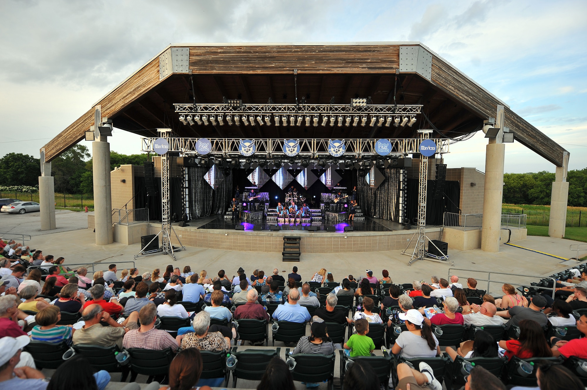 People witness the Tops in Blue Performance June 27, at the Sumtur Amphitheater, Papillion, Neb.  The Tops in Blue ensemble drew a large crowd during their stop in the Omaha metro area.  (U.S. Air Force photo by/Josh Plueger Released)  
