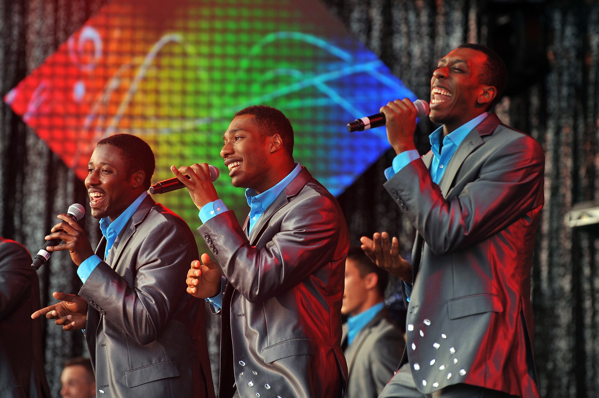 The male vocalists of the Tops in Blue group bring an energetic performance to concert goers during their performance June 27at the Sumtur Amphitheater, Papillion, Neb.  The high-tempo concert lasted for 90 minutes.  (U.S. Air Force photo by/Josh Plueger Released)  