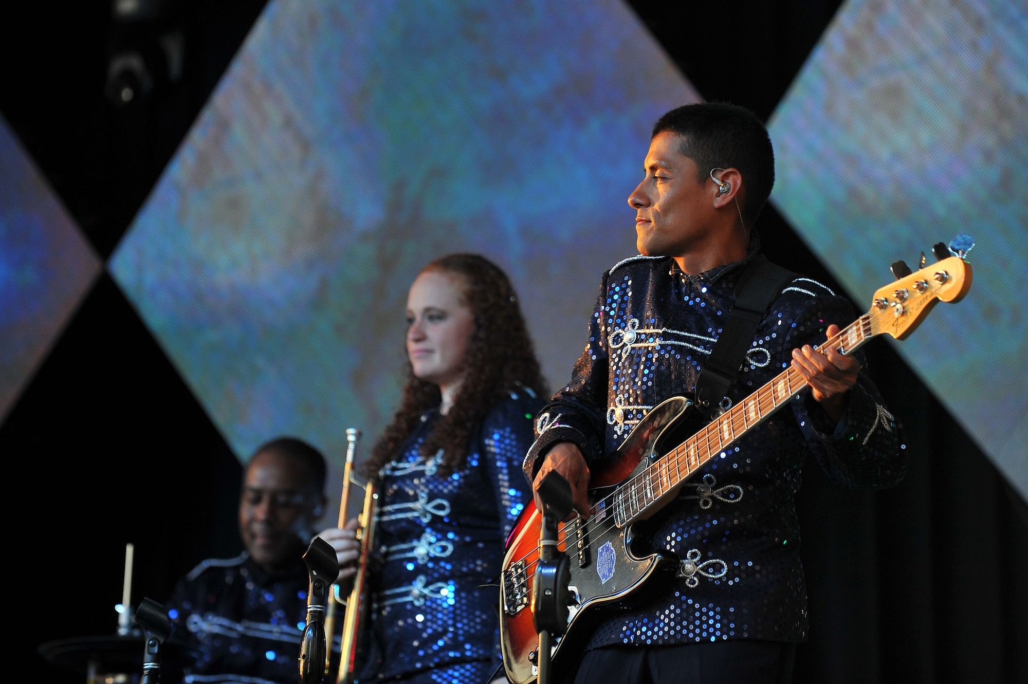 U.S. Air Force Senior Airman Kenny Casaverde, a Personnel Airman with the 802d Force Support Squadron out of Joint Base San Antonio-Lackland Air Force Base, Texas, plays his guitar at the Tops in Blue concert June 27 at the Sumtur Amphitheater, Papillion, Neb.  The Tops in Blue team is comprised solely of U.S. Air Force Airmen.  (U.S. Air Force photo by/Josh Plueger Released)  