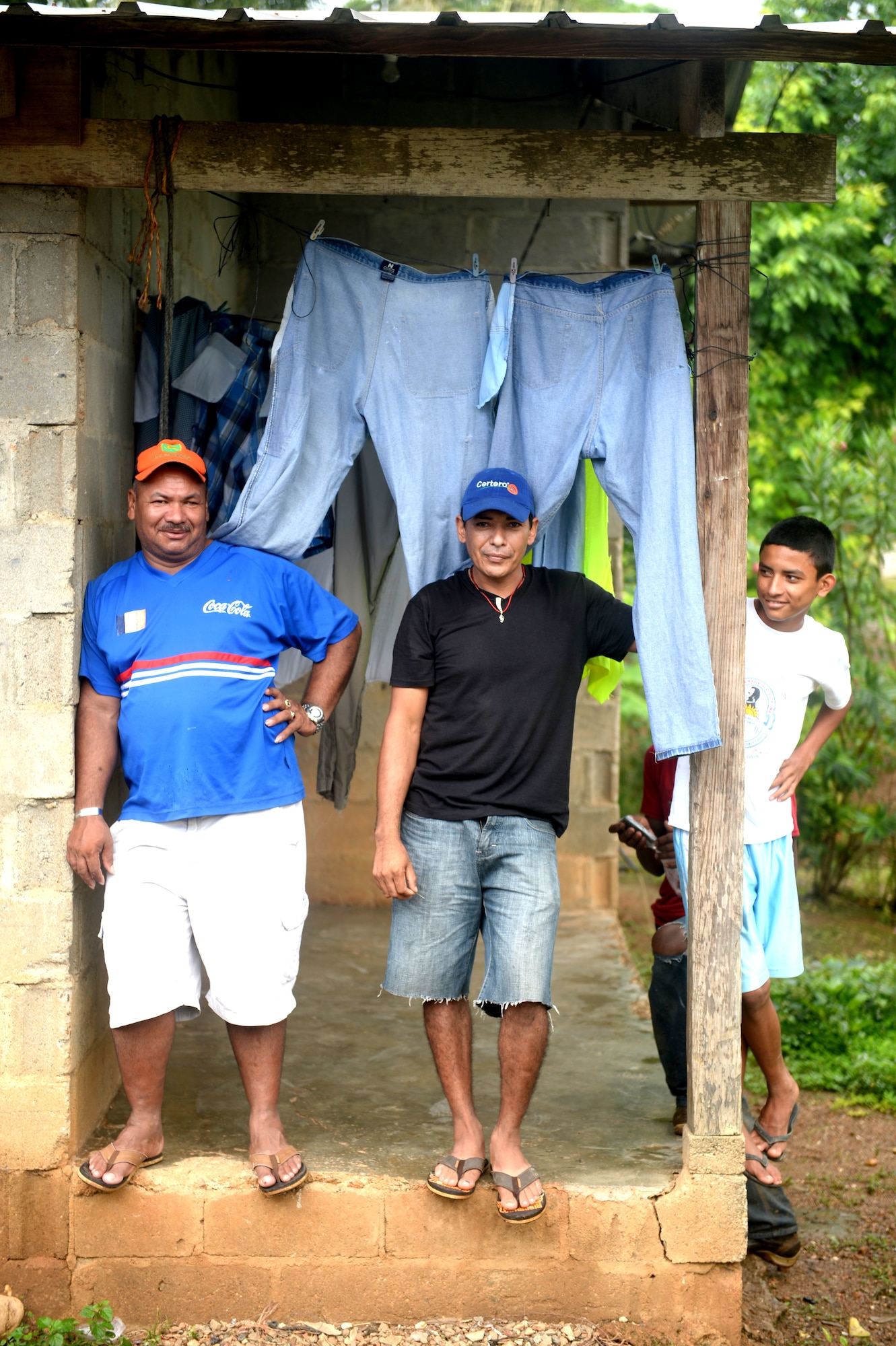 Honduras Aguan residents pose for a photo at the village of Honduras Aguan near Trujillo, Honduras, June 25, 2015. The village residents are the recipient of the new well being drilled by members of the NEW HORIZONS Honduras 2015 training exercise. NEW HORIZONS was launched in the 1980s and is an annual joint humanitarian assistance exercise that U.S. Southern Command conducts with a partner nation in Central America, South America or the Caribbean. The exercise improves joint training readiness of U.S. and partner nation civil engineers, medical professionals and support personnel through humanitarian assistance activities. (U.S. Air Force photo by Capt. David J. Murphy/Released)