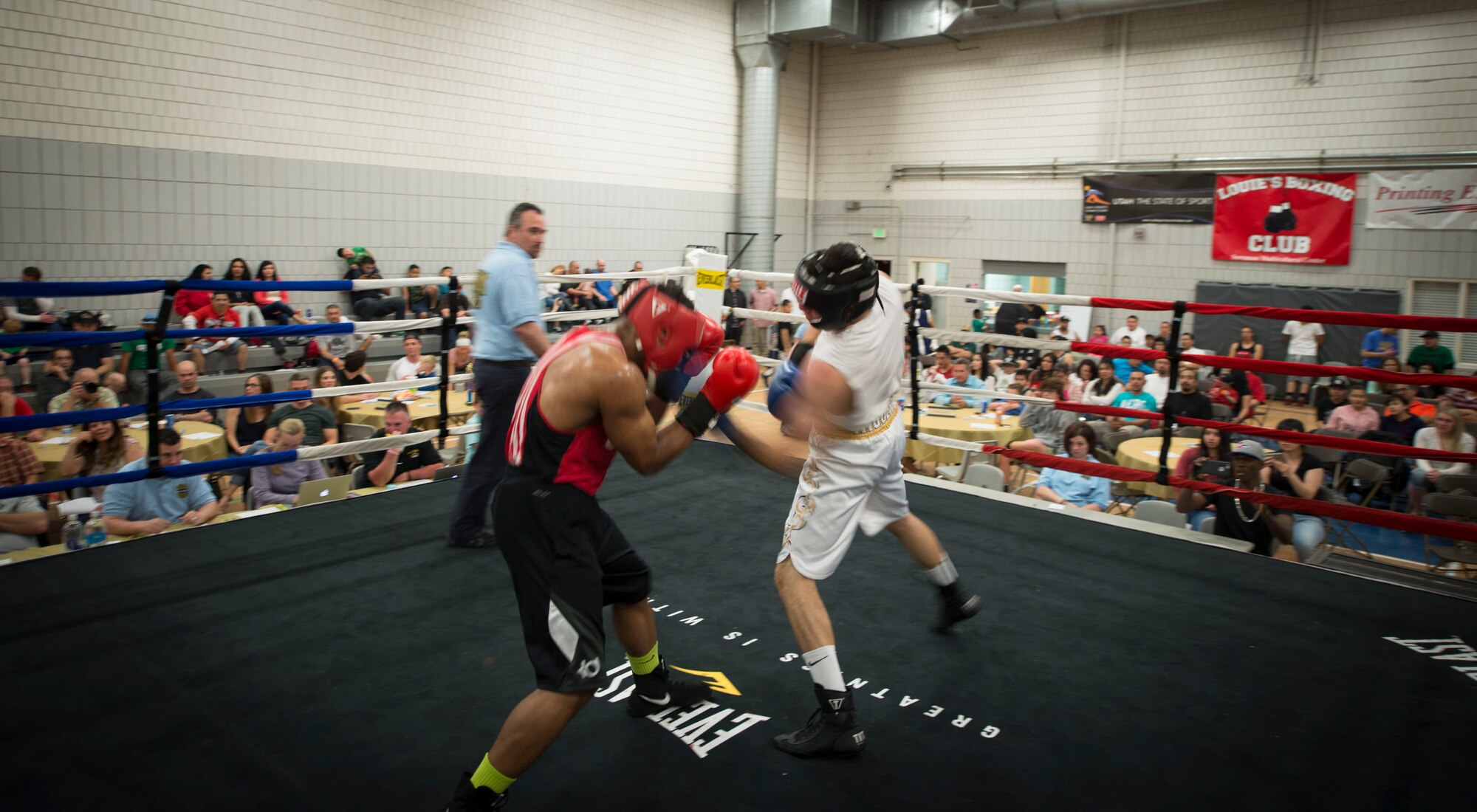 Juan Higuera, right, lands a blow on Senior Airman Martin E. Bills III, 366th Security Forces Squadron response force leader, during a fight at the Sorenson Center in Salt Lake City, March 28, 2015. Higuera began attacking once he saw Bills slow down. (U.S. Air Force photo by Airman 1st Class Jeremy L. Mosier/Released)