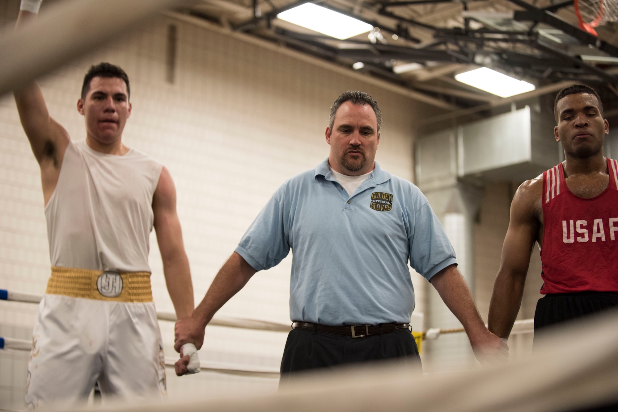 Senior Airman Martin E. Bills III, 366th Security Forces Squadron response force leader, waits for the announcement of the winner at The Sorenson Center in Salt Lake City, March 28, 2015. His opponent, Juan Higuera, ultimately won the match. Although the outcome didn't go as planned, Bills took it as a learning experience and expressed determination to come out even stronger in the next fight. (U.S. Air Force photo by Airman 1st Class Jeremy L. Mosier/Released)