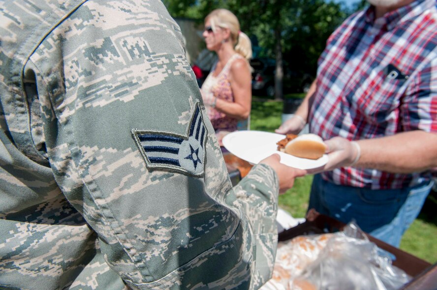 An Airman receives a complementary lunch during military appreciation day at the Roosevelt Park Zoo in Minot, N.D., June 26, 2015. Attendees were granted free entry into the zoo along with a free lunch. (U.S. Air Force photo/Airman 1st Class Sahara L. Fales)