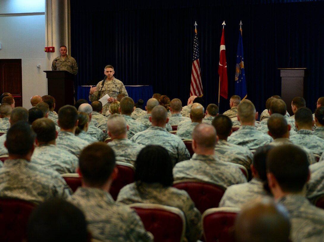 Col. Archibald Bruns, Air Force Personnel Center director of personnel services, addresses Airmen about the Enlisted Evaluation System and the Weighted Airman Promotion System changes during a briefing June 26, 2015, at Incirlik Air Base, Turkey. The senior leaders addressed changes that have been implemented and those that will be implemented in the coming months. (U.S. Air Force photo by Staff Sgt. Caleb Pierce/Released)