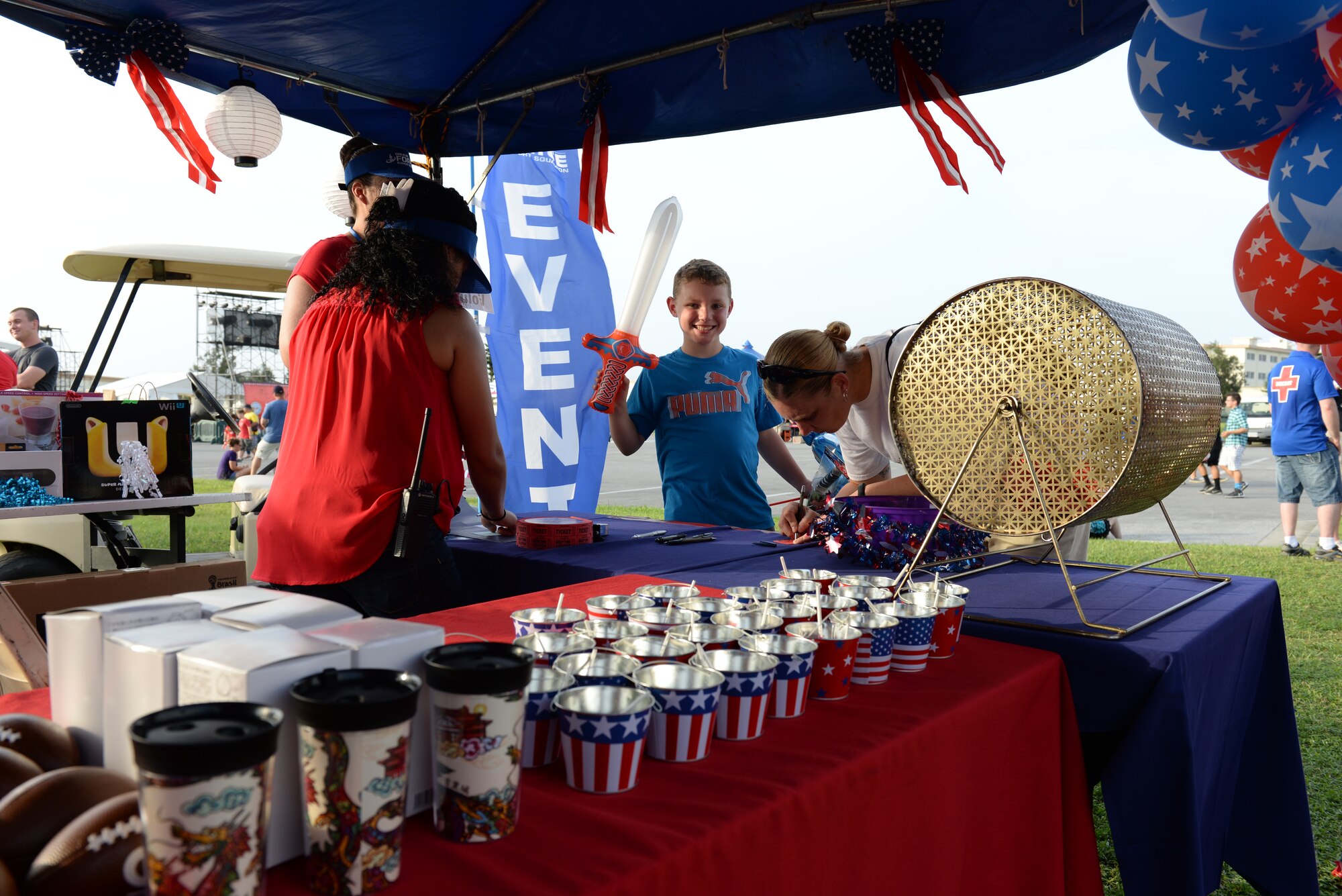 The 18th Force Support Squadron hosts prize drawings and raffles during Rockin’ the Block on Kadena Air Base, Japan, June 27, 2015. The event featured live music, crafts, food and playgrounds for members of Team Kadena and their families. Rockin’ the Block is a community based event held by the 18th FSS in honor of the Fourth of July. (U.S. Air Force photo by Senior Airman Omari Bernard)