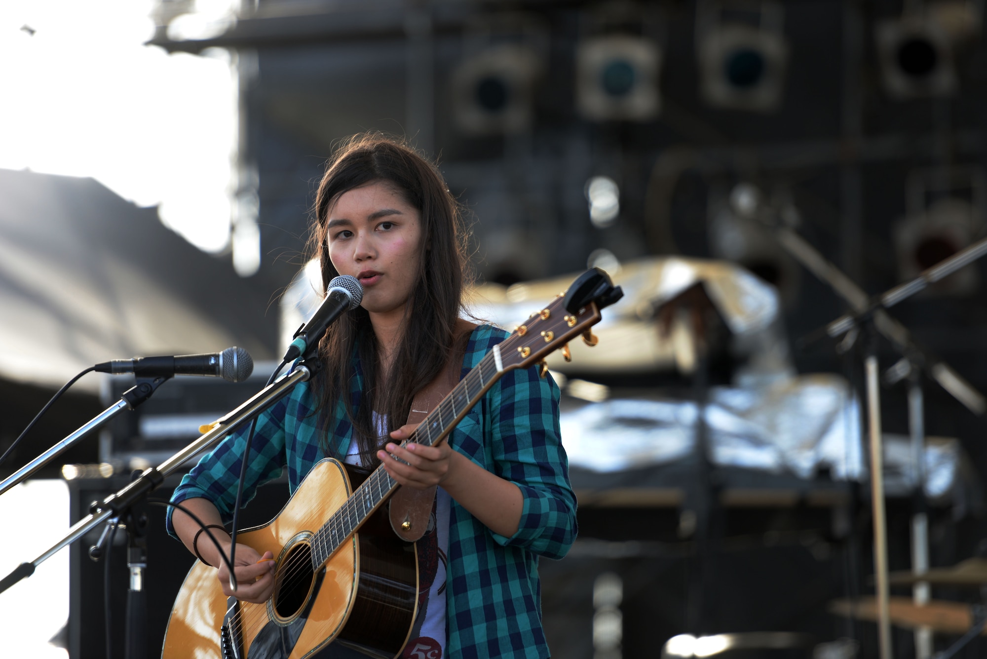 Local artist ‘Anly’ performs during the 18th Force Support Squadron’s Rockin’ the Block on Kadena Air Base, Japan, June 27, 2015. The event featured live music, crafts, food and prize drawings. Rockin’ the Block was open to Status of Forces Agreement personnel and their families. (U.S. Air Force photo by Senior Airman Omari Bernard)