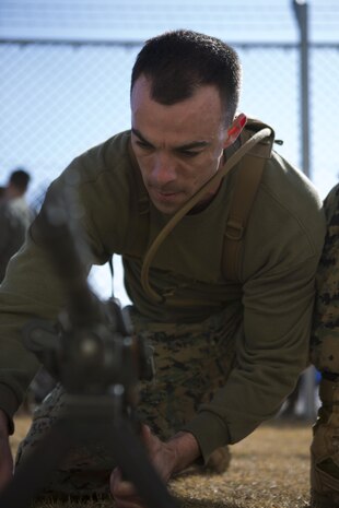 A participant reassembles a M240 machine gun during the third event in the Frozen Chosin competition aboard Marine Corps Air Station Iwakuni, Japan, Feb. 27, 2015. The Frozen Chosin competition strengthens cohesion within the unit and resembles the austere endeavors of Marines during the Battle of the Chosin Reservoir in 1950.