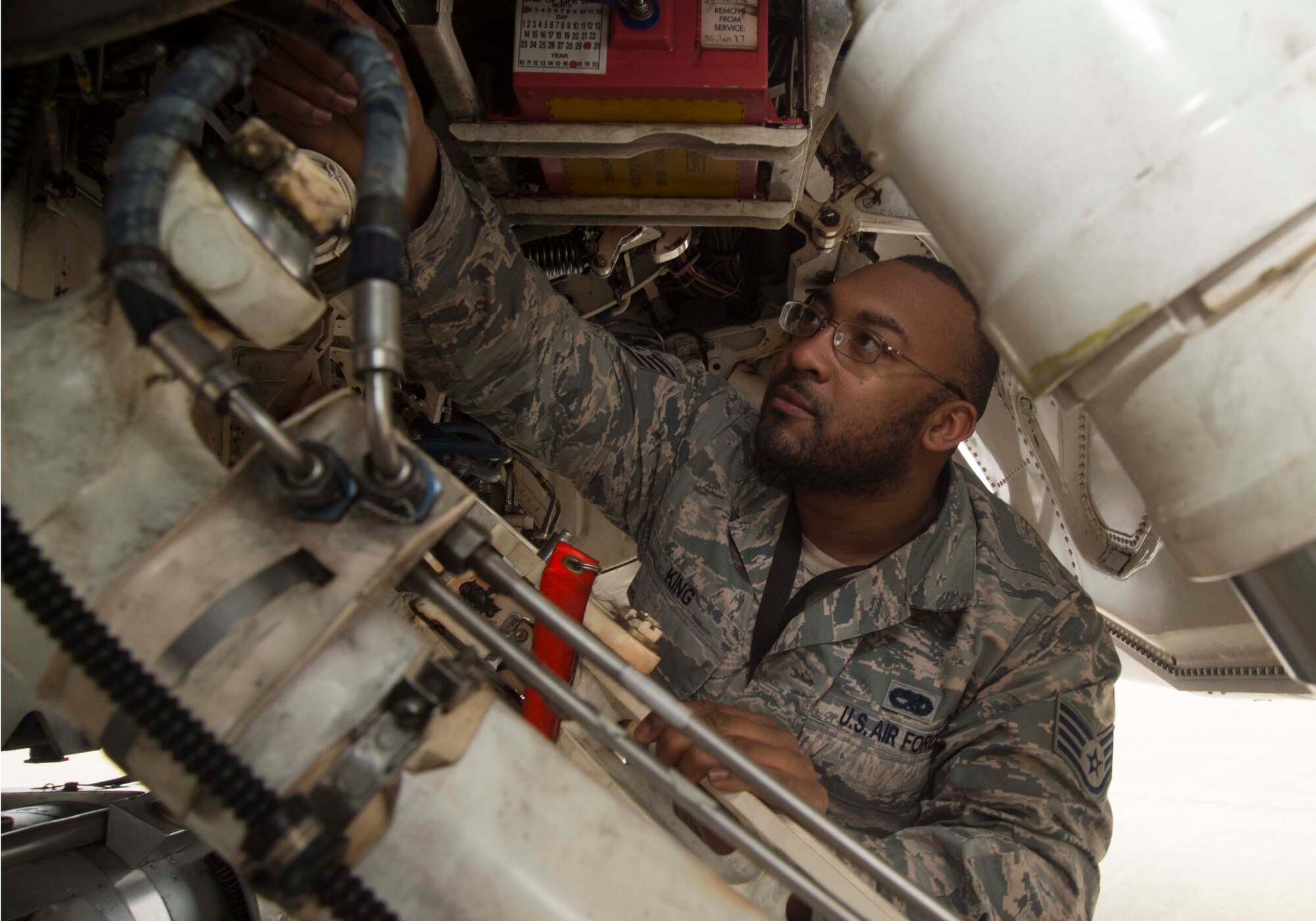 U.S. Air Force Staff Sgt. James King, 35th Aircraft Maintenance Squadron dedicated crew chief, performs a pre-flight inspection on an F-16 Fighting Falcon in support of Exercise Beverly Sunrise 15-2 at Misawa Air Base, Japan, March 1, 2015. Beverly Sunrise is an operational readiness exercise that tests Airmen’s ability to incorporate wartime procedures into their daily duties. King, who is attached to the 13th Aircraft Maintenance Unit, is one of several crew chiefs who generated aircraft in support of the ORE. (U.S. Air Force photo by Staff Sgt. Alyssa C. Wallace/Released)