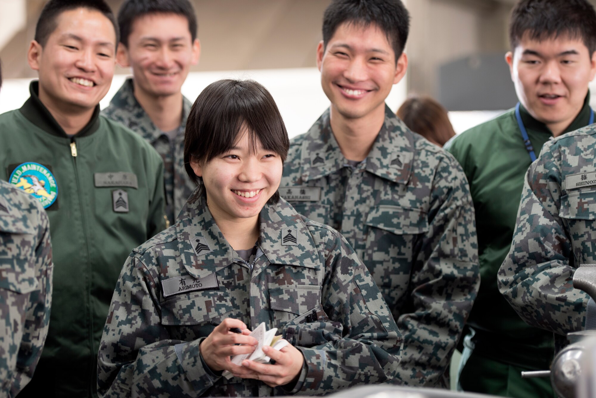 Students from the Japan Air Self-Defense Force basic maintenance officer school listen to a brief from Tech. Sgt. James Cone, 374th Maintenance Group nondestructive inspection section chief, at Yokota Air Base, Japan, Feb. 25, 2015. By visiting Yokota, the students learned operations of the aircraft maintenance group. (U.S. Air Force photo by Airman 1st Class Delano Scott/Released)