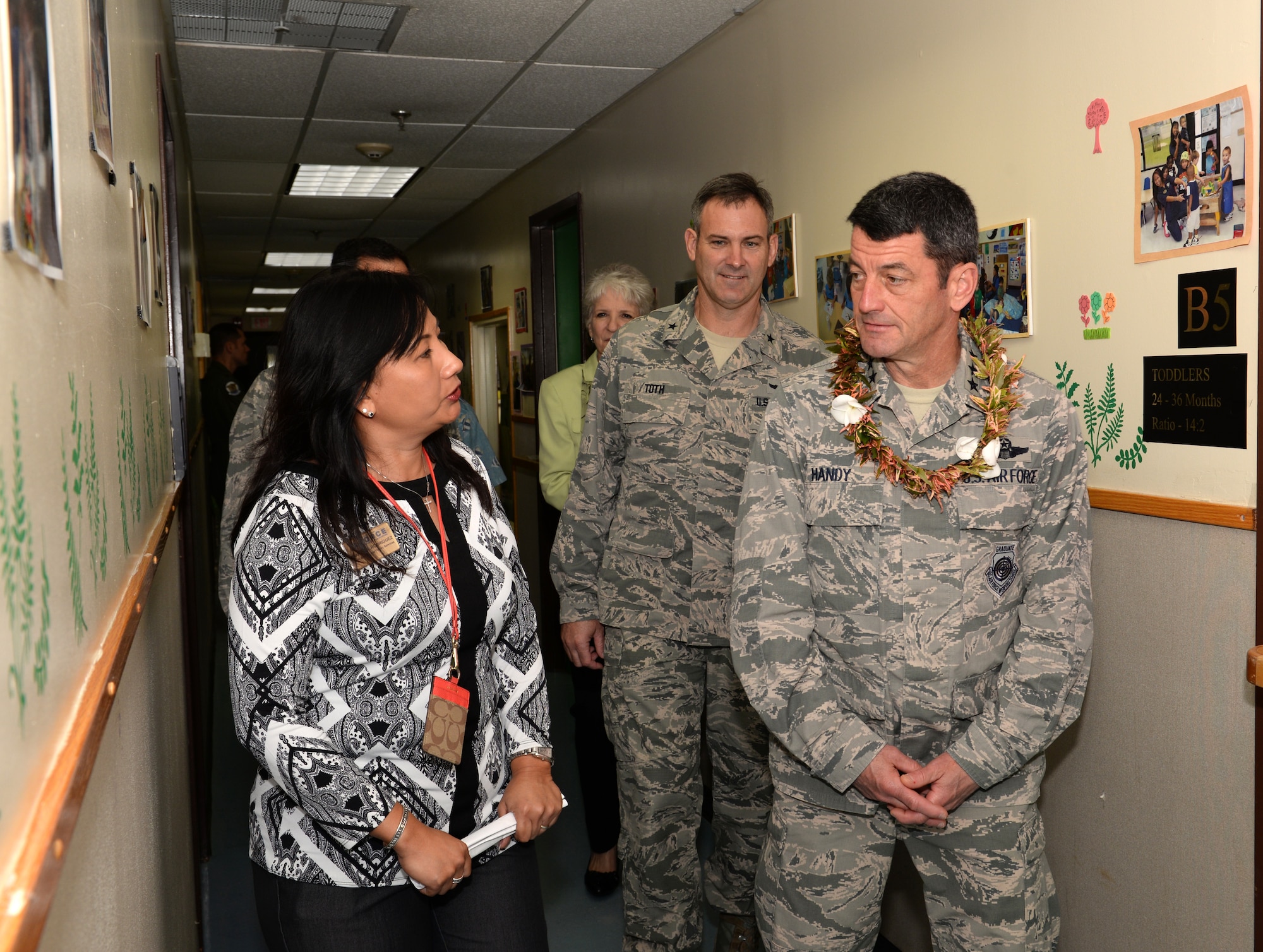 Lt. Gen. Russell Handy, 11th Air Force commander, and Brig. Gen. Andrew Toth, 36th Wing commander, tour the Child Development Center with Jeanette Rodriguez, Airman and Family Services flight chief, Feb. 24, 2015, at Andersen Air Force Base, Guam. During his week-long tour, he also visited different squadrons around Andersen and held an Airman’s call to discuss the strategic rebalance to the Pacific. (U.S. Air Force photo by Senior Airman Amanda Morris/Released)
