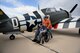Retired Air National Guard Chief Warrant Officer 2 Robert Hertel is wheeled around a P-47 Thunderbolt during the Heritage Flight Training and Certification Course at Davis-Monthan Air Force Base, Ariz., Feb. 28, 2015. Hertel flew the Thunderbolt over Iwo Jima, Japan during World War II and had not seen one since the 1960's. (U.S. Air Force photo by Senior Airman Jensen Stidham/Released)