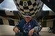 Retired Air National Guard Chief Warrant Officer 2 Robert Hertel, laughs while sitting in front of a P-47 Thunderbolt during the Heritage Flight Training and Certification Course at Davis-Monthan Air Force Base, Ariz., Feb. 28, 2015. Hertel, a 92-year-old  World War II veteran, flew the aircraft while stationed in Iwo Jima, Japan. (U.S. Air Force photo by Senior Airman Jensen Stidham/Released)