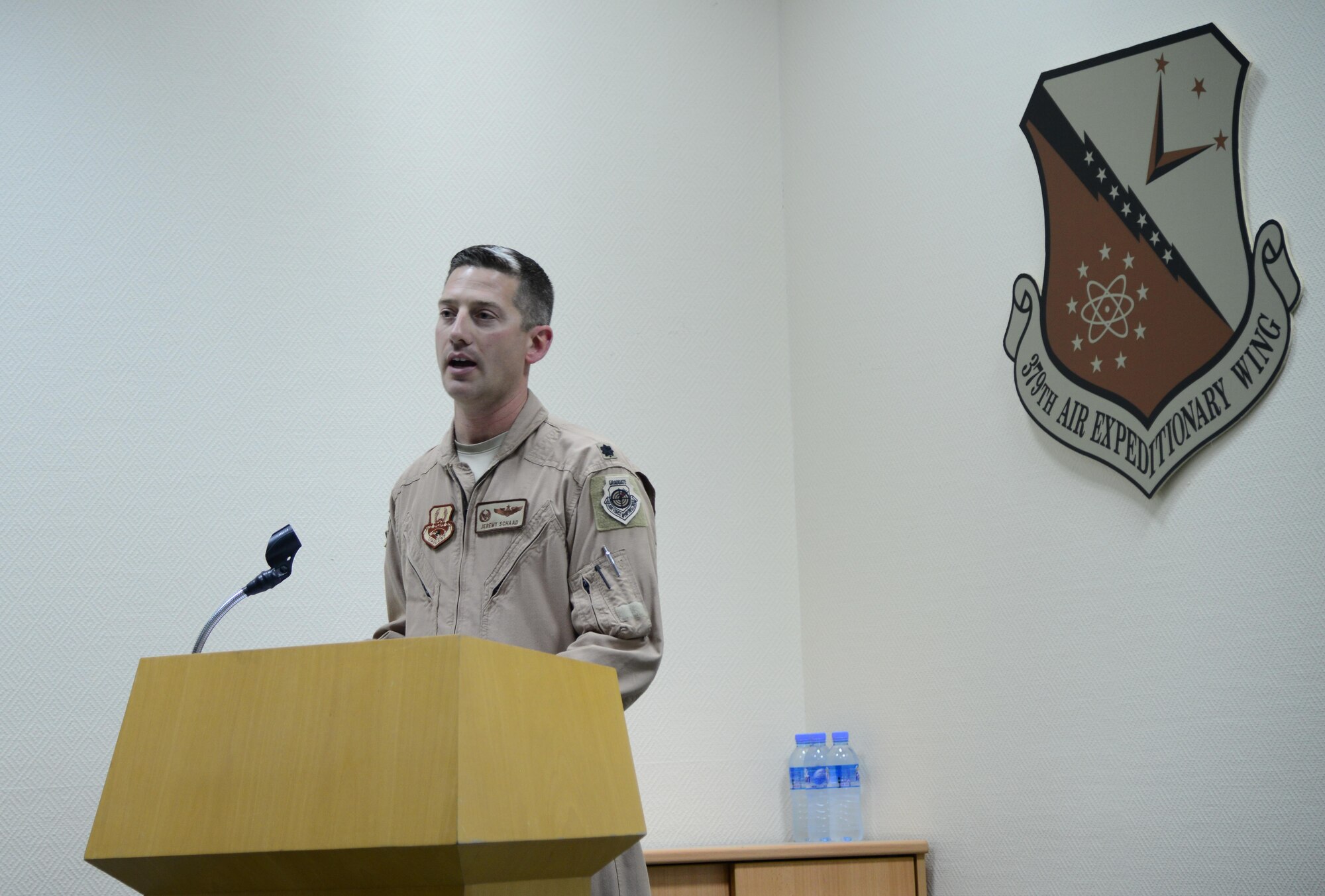 U.S. Air Force Lt. Col. Jeremy Schaad gives remarks before handing over command  of the 746th Expeditionary Airlift Squadron during a change of command ceremony, March 1, 2015, at Al Udeid Air Base, Qatar. Schaad relinquished command of the 746th EAS to Lt. Col. Byron Newell. (U.S. Air Force photo by Senior Airman Kia Atkins)