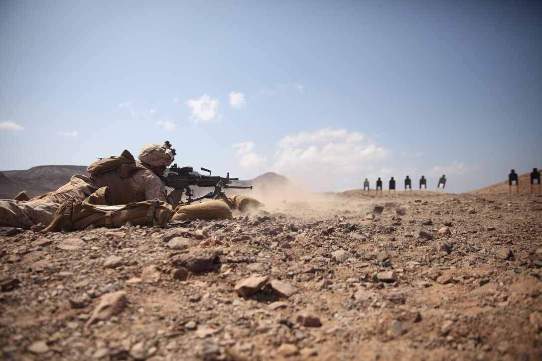 A Marine with Battalion Landing Team 3rd Battalion, 6th Marine Regiment, 24th Marine Expeditionary Unit, fires his M249 Squad Automatic Weapon during a live-fire machine gun range in Djibouti, Feb. 18, 2015. A contingent of MEU Marines was ashore in Djibouti conducting sustainment training in order to maintain proficiency while deployed. The 24th MEU is embarked on the ships of the Iwo Jima Amphibious Ready Group and deployed to maintain regional security in the U.S. 5th Fleet area of operations.