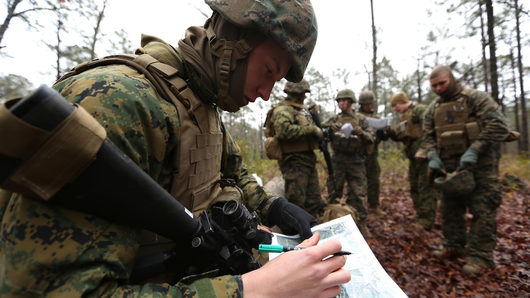PFC Clayton Bolen, a combat engineer with 8th Engineer Support Battalion, plots points on a map before executing a patrolling exercise aboard Marine Corps Base Camp Lejeune, N.C. Feb. 26, 2015. The patrolling exercise gave the unit a sense of their proficiency level and how it can be improved in the future. 