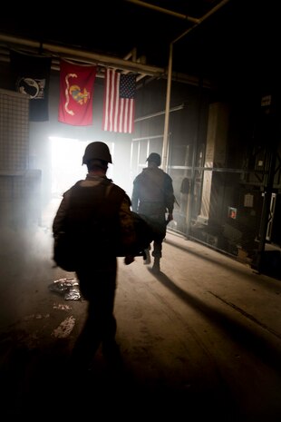 Field medical service technicians with 2nd Medical Battalion, 2nd Marine Logistics Group, carry a simulated casualty out of the kill zone during the culminating even for a week-long Tactical Combat Casualty Care course aboard Marine Corps Base Camp Lejeune, N.C., Feb. 26, 2015. The course had students with different levels of rank and experience focusing on the importance of not only treating a casualties injuries, but also on how to conduct pain management, call in a 9-line, and safely extract the casualty from the danger zone while maintaining situational awareness in combat. (U.S. Marine Corps photo by Cpl. Krista James/Released)