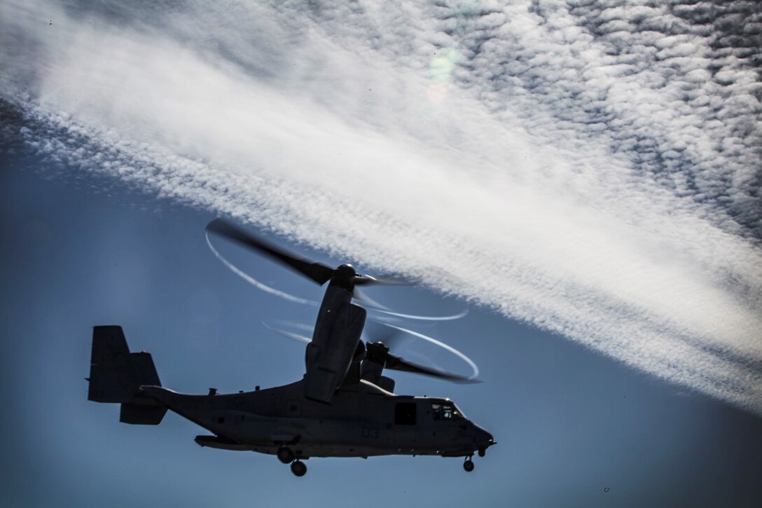 An MV-22 Osprey with Marine Medium Tiltrotor Squadron 161 (Reinforced), 15th Marine Expeditionary Unit, prepares to land on the USS Essex (LHD 2) during Amphibious Squadron/Marine Expeditionary Unit Integration Training (PMINT) off the coast of San Diego Feb. 28, 2015. The 15th MEU’s air combat element is training with the Sailors of the Essex Amphibious Ready Group to improve their ability handle flight operations while embarked. (U.S. Marine Corps photo by Cpl. Elize McKelvey/Released)