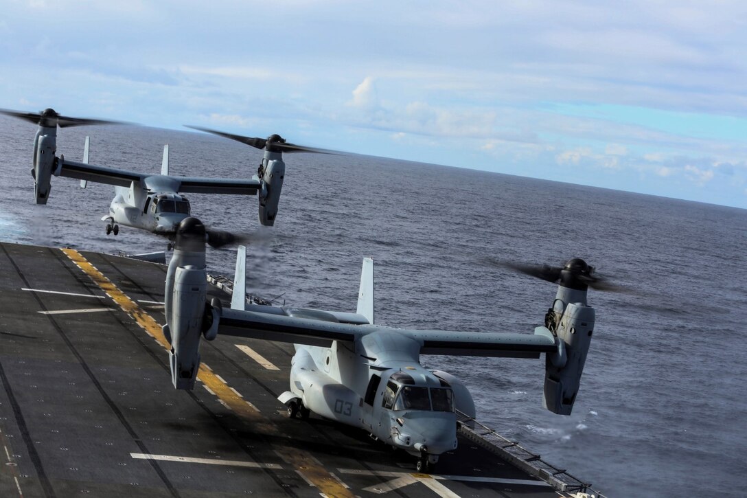 MV-22B Ospreys with Marine Medium Tiltrotor Squadron 161 (Reinforced), 15th Marine Expeditionary Unit, land on the USS Essex (LHD 2) during Amphibious Squadron/Marine Expeditionary Unit Integration Training (PMINT) off the coast of San Diego Feb. 28, 2015. The pilots of the 15th MEU’s air combat element practiced landing and takeoff procedures while at sea. (U.S. Marine Corps photo by Cpl. Anna Albrecht/ Released)