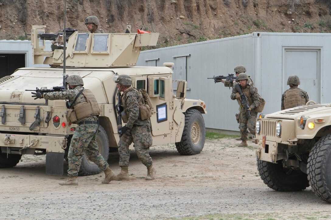 The QRF security element posts up four-corner security around an objective site during a Quick Reaction Force drill, as part of Marine Expeditionary Force Exercise 2015 aboard Camp Pendleton, Calif., Feb. 22, 2015. Marines with 1st Law Enforcement Battalion employed a QRF to combat imminent “enemy threats” during MEFEX-15.