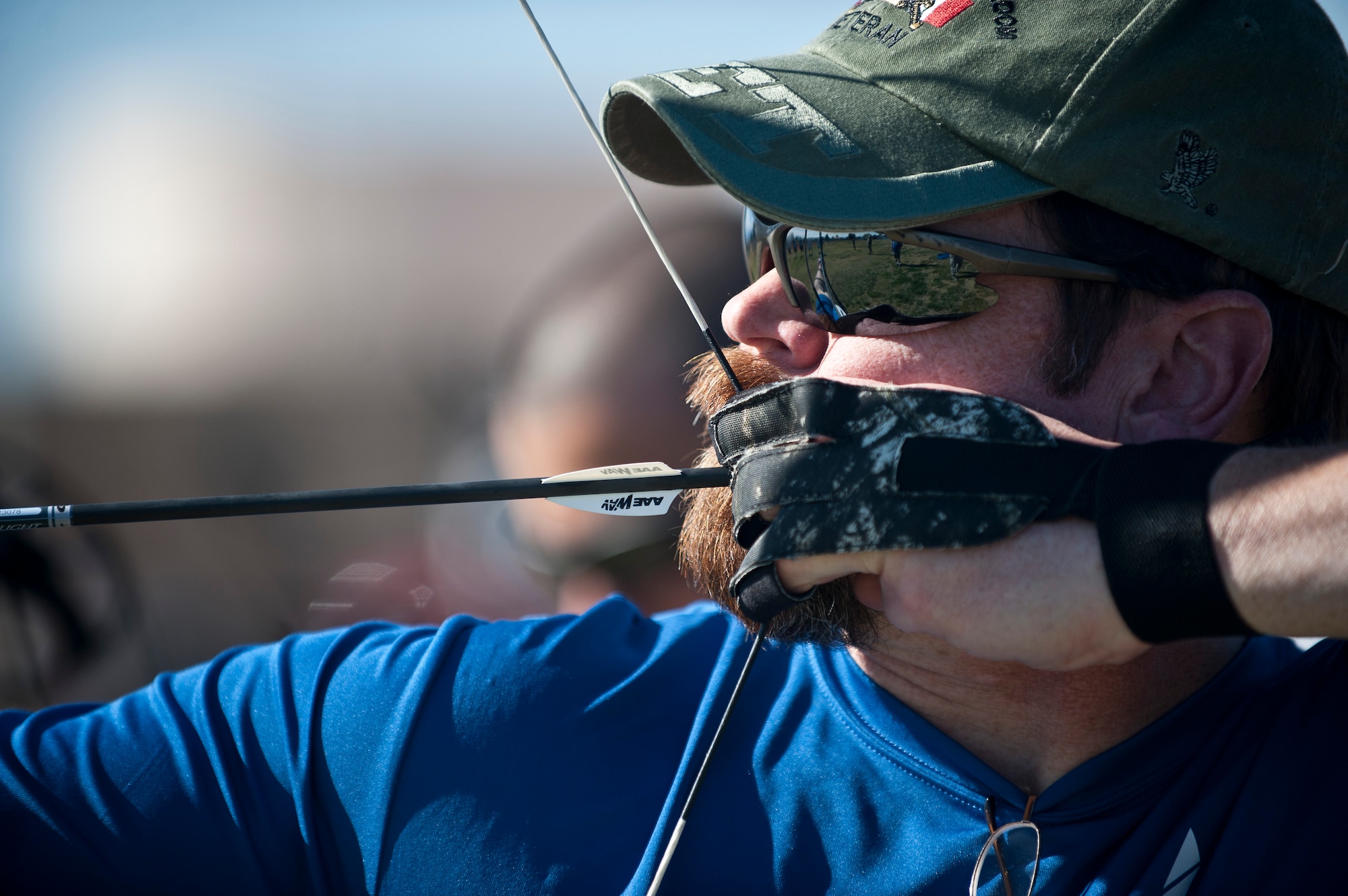 Retired U.S. Air Force Chief Master Sgt. Robert Zukauskas, 2015 U.S. Air Force Trials participant, aims at a target during an archery practice session at Nellis Air Force Base, Nev., Feb. 27, 2015. Zukauskas suffered multiple injuries from a rocket attack during a deployment to Iraq in 2009. (U.S. Air Force photo by Staff Sgt. Siuta B. Ika)