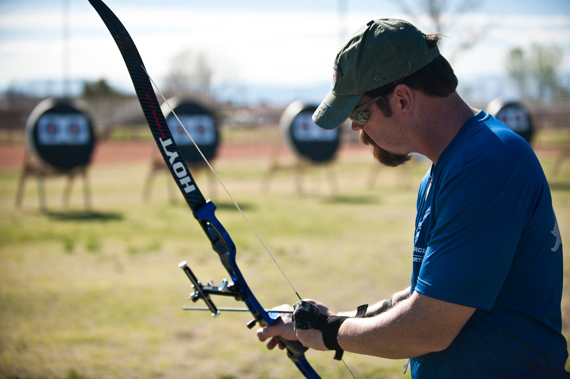 Retired U.S. Air Force Chief Master Sgt. Robert Zukauskas, 2015 U.S. Air Force Trials participant, prepares to shoot a target during an archery practice session at Nellis Air Force Base, Nev., Feb. 27, 2015. Zukauskas is naturally right-handed, but has learned to shoot archery left-handed after sustaining multiple injuries to the right side of his body during a deployment to Iraq in 2009. (U.S. Air Force photo by Staff Sgt. Siuta B. Ika)
