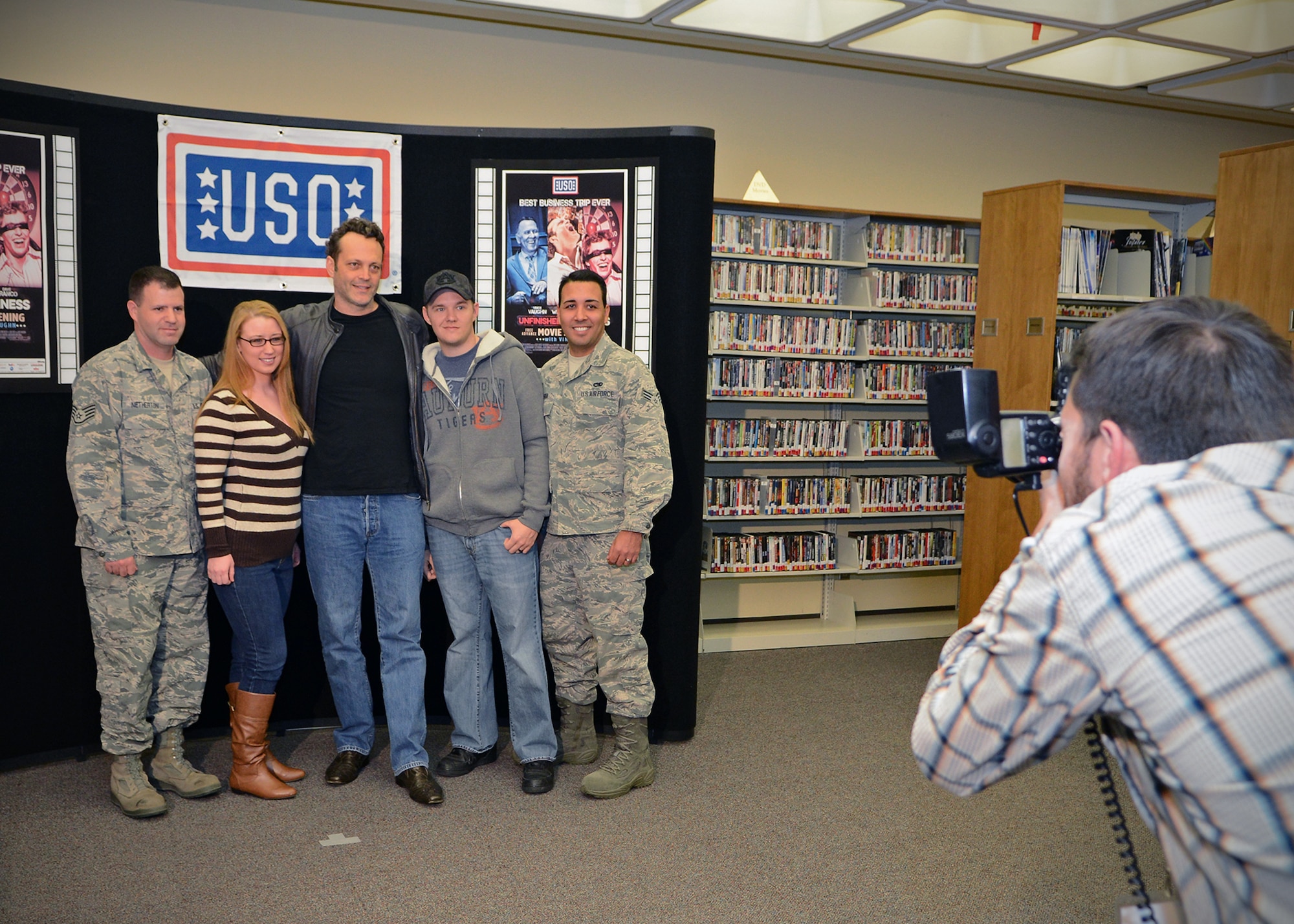 Actor Vince Vaughn poses for photos with Edwards Airmen and their families at the base library before introducing an advance screening of his new movie, "Unfinished Business," at the base theater Feb. 28. (U.S. Air Force photo by Jet Fabara)