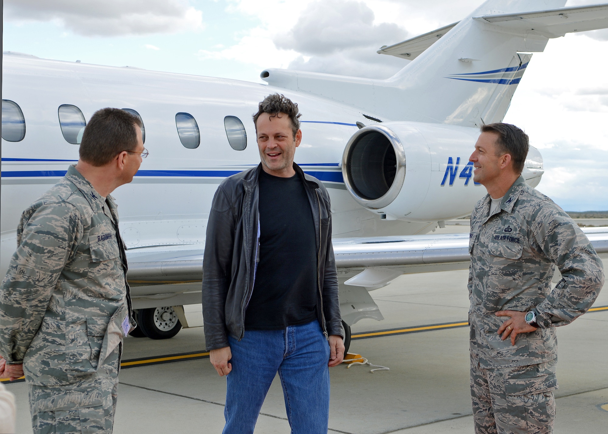 Col. David Radomski (left), 412th Test Wing vice commander, and Col. Eric Leshinsky, 412th Mission Support Group commander (right) welcome Actor Vince Vaughn upon his arrival for his third USO tour at Edwards Feb. 28. During Vaughn’s visit to Edwards, he met with Airmen and their families and introduced an advance screening of his new movie, "Unfinished Business," at the base theater. (U.S. Air Force photo by Jet Fabara)